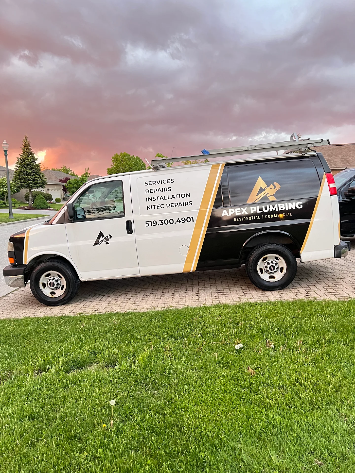 Apex Plumbing’s white, black and gold service van displaying 519-300-4901 and residential and commercial plumbing services